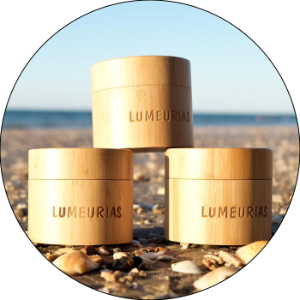 lumeurias bamboo packaging on the sand at the beach - lumeurias shop